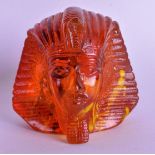 AN EARLY 20TH CENTURY EGPYTIAN REVIVAL CARVED AMBER BUST in the form of a Pharaoh 191 grams. 7.5 cm