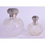 TWO ANTIQUE SILVER SCENT BOTTLES AND STOPPERS. 13 cm & 9 cm high. (2)