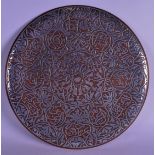 AN EARLY 20TH CENTURY MIDDLE EASTERN SILVER INLAID COPPER DISH decorated with foliage and vines. 39