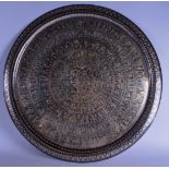 A LARGE EGYPTIAN REVIVAL COPPER AND SILVER INLAID TRAY decorated with figures. 80 cm diameter.