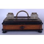 A VICTORIAN WOODEN CUT GLASS DOUBLE INKWELL, formed with single drawer and applied brass decoration.