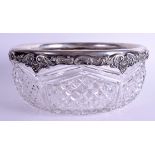A LARGE EARLY 20TH CENTURY STERLING SILVER CUT GLASS BOWL. 24 cm wide.