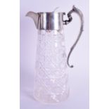 A SILVER MOUNTED CUT GLASS CLARET JUG. Sheffield 1907. 25 cm high.