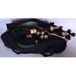 A SET OF VINTAGE SCOTTISH IVORY AND WOODEN BAGPIPES, with associated bag.