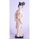 A 19TH CENTURY CHINESE CARVED IVORY FIGURE OF A FEMALE modelled holding a floral sprig. Ivory 28 cm