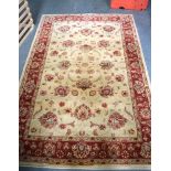 A BEIGE GROUND PERSIAN RUG, decorated with sprays of foliage. 178 cm x 120 cm.