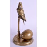 A 19TH CENTURY AUSTRIAN BRONZE INKWELL in the form of a bird upon a perch. 17 cm high.