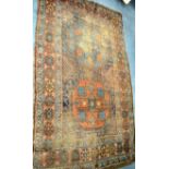 A DISTRESSED ANTIQUE CAUCASION RUG, decorated with foliage and motifs. 197 cm x 115 cm.