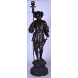 A LARGE SPELTER FIGURAL LAMPFORMED AS A STANDING MALE, modelled with sword at side upon a circular b