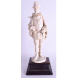 A LARGE 19TH CENTURY GERMAN CARVED IVORY FIGURE OF A MALE modelled as a standing dandy. Ivory 31 cm