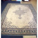 A LARGE GREEN AND BEIGE GROUND PERSIAN RUG OR CARPET, decorated with foliage. 292 cm x 204 cm.