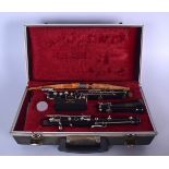 A BOOSEY AND HAWKES WOODEN CLARINET, contained within fitted case.