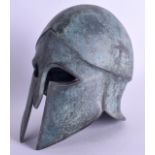 A GREEK BRONZE ANTIQUITY STYLE HELMET. 19 cm x 12 cm.