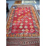 AN ANTIQUE TURKISH ANATOLIAN KILIM RUG, decorated with motifs. 265 cm x 163 cm.