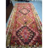 AN ANTIQUE TURKISH ANATOLIAN OVERSIZE KILIM RUG, woven in two long strips. 385 cm x 160 cm.