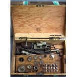 A QUANTITY OF CLOCK MAKERS TOOLS, contained within a wooden box. (qty)