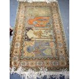 AN EARLY 20TH CENTURY PERSIAN TABRIZ RUG, decorated with panels depicting landscapes. 157 cm x 85 cm