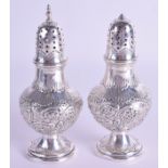 TWO 19TH CENTURY SILVER PEPPERETTES. 8.2 oz. 14 cm high. (2)