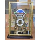 A LARGE GLASS CASED SKELETON CLOCK. 38 cm x 17 cm.