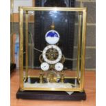 A LARGE GLASS CASED SKELETON CLOCK. 36 cm x 12 cm.