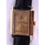 A 14CT GOLD BAUME & MERCIER WRISTWATCH. 2 cm x 2.5 cm.