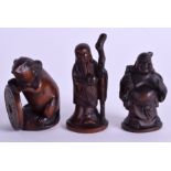 THREE CARVED WOOD NETSUKES. 5 cm high. (3)