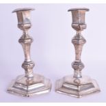 A PAIR OF ANTIQUE SILVER CANDLESTICKS. 17 cm high.