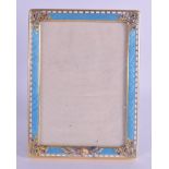 AN UNUSUAL CONTINENTAL SILVER GILT AND ENAMEL PHOTOGRAPH FRAME decorated with Egyptian revival