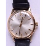 A 9CT GOLD OMEGA AUTOMATIC WATCH. 3.25 cm wide.