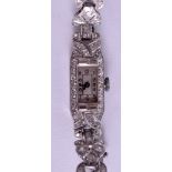 AN ART DECO PLATINUM AND DIAMOND WATCH. 21.2 grams. 1 cm x 3 cm.