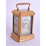 A MINIATURE BRASS AND PORCELAIN CARRIAGE CLOCK. 8 cm high inc handle.