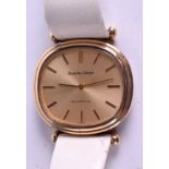 A 9CT GOLD BUECHE GIROD WATCH. 3.5 cm wide.