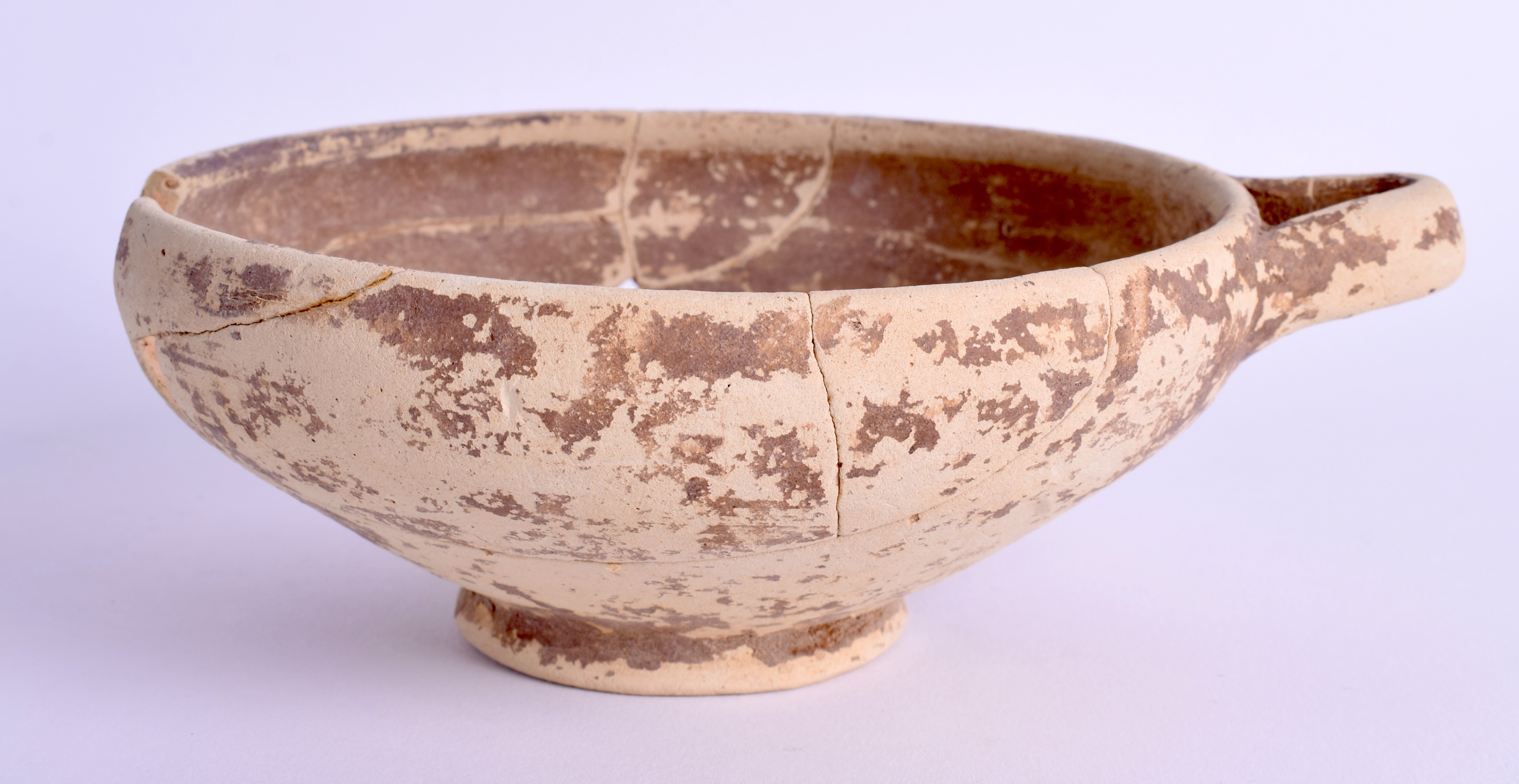 A MIDDLE EASTERN POTTERY BOWL. 14 cm wide.