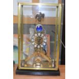 A LARGE GLASS CASED SKELETON CLOCK. 45 cm x 20 cm.