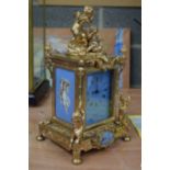 AN ORMOLU PORCELAIN CARRIAGE CLOCK. 31 cm x 13 cm.