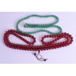 A CHINESE JADEITE NECKLACE together with a cherry amber type necklace. (2)