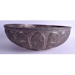 A VERY LARGE 19TH CENTURY INDIAN PERSIAN WHITE METAL BOWL decorated with animals and landscapes. 48