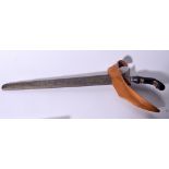 AN INDONESIAN SUMATRA KRIS DAGGER, formed with wooden handle and copper scabbard. 52 cm long.