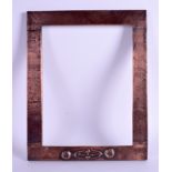 A SCOTTISH ARTS AND CRAFTS GLASGOW SCHOOL COPPER FRAME with Mackintosh inspired motifs. 27 cm x 21