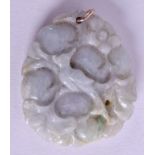 AN EARLY 20TH CENTURY CHINESE CARVED JADEITE PENDANT. 3.5 cm x 3.5 cm.