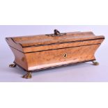 AN ANTIQUE AMBOYNA JEWELLERY BOX with paw feet. 22 cm x 10 cm.