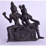 A 19TH CENTURY INDIAN BRONZE FIGURE OF TWO DEITY modelled upon a rectangular base. 9 cm x 11 cm.