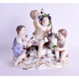 A 19TH CENTURY MEISSEN PORCELAIN FIGURE OF FOUR CHILDREN modelled seated upon a recumbent deer. 18