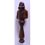 A RARE LATE 18TH CENTURY EUROPEAN TREEN NUT CRACKER modelled as a beaded male. 18 cm long.