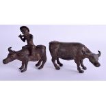 A PAIR OF 19TH CENTURY CONTINENTAL COLD PAINTED FIGURES OF BUFFALO one with attendant. 12 cm wide.