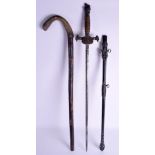 AN UNUSUAL ANTIQUE SWORD with helmet terminal, together with a walking cane. 90 cm long. (2)