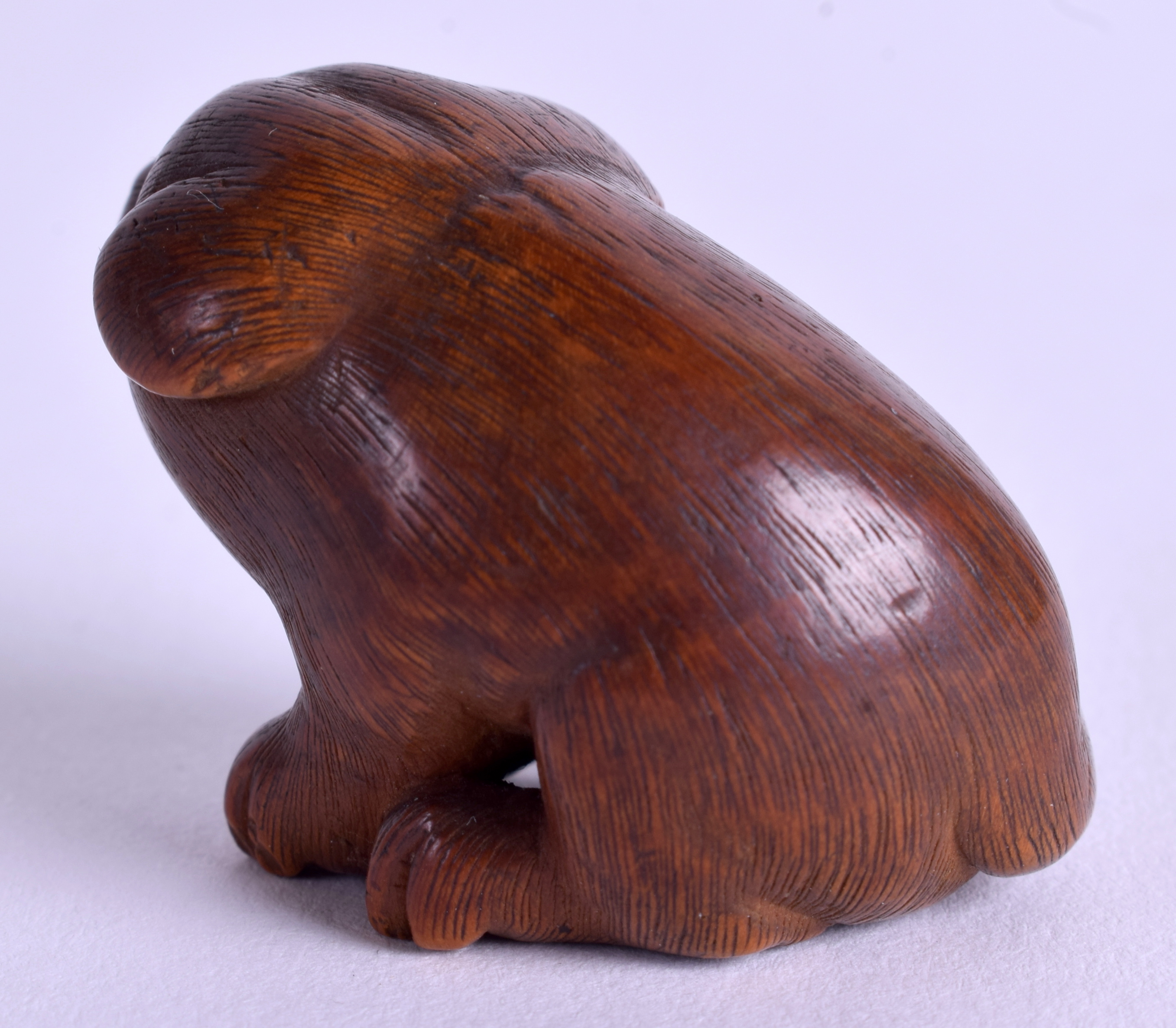 A LOVELY 19TH CENTURY JAPANESE MEIJI PERIOD BOXWOOD NETSUKE modelled as a recumbent puppy. 3 cm x 2 - Image 2 of 3