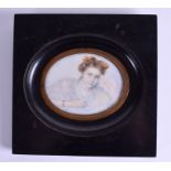 A MID 19TH CENTURY PAINTED IVORY PORTRAIT MINIATURE depicting a female wearing a brown bow. 9.5 cm