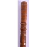 AN EARLY 20TH CENTURY CONTINENTAL CARVED WOOD FOLK ART WALKING CANE decorated with foliage and leav