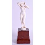 A 1920S ANGLO INDIAN CARVED IVORY FIGURE OF A FEMALE modelled upon a red marble base. Ivory 14.5 cm